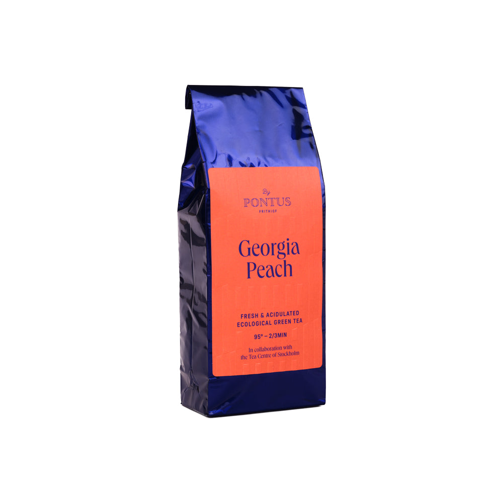 Georgia Peach EKO refill från Pontus Frithiof – ekologiskt grönt te med fläderblommor och persika i elegant orange påse.